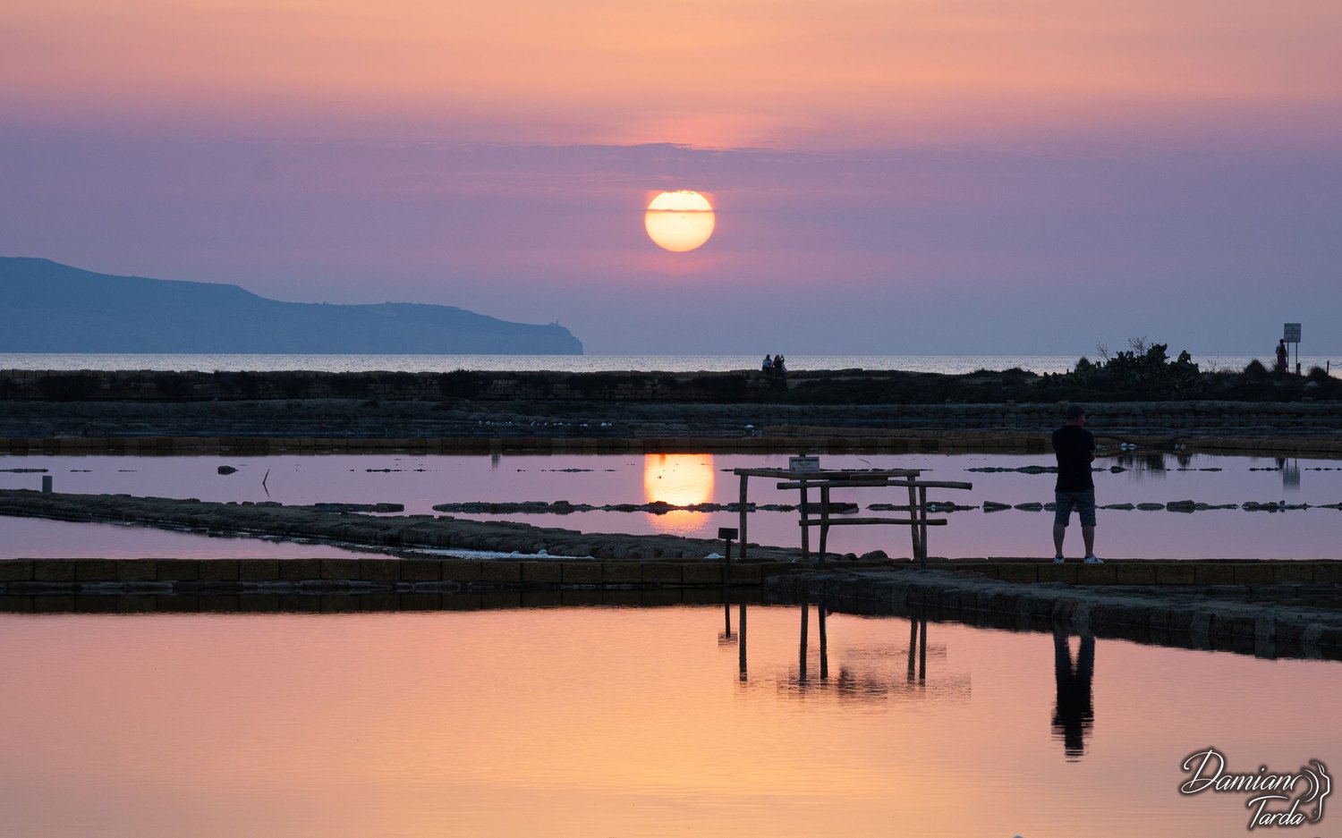 Tramonto sulle saline di Trapani. Fotografia paesaggistica